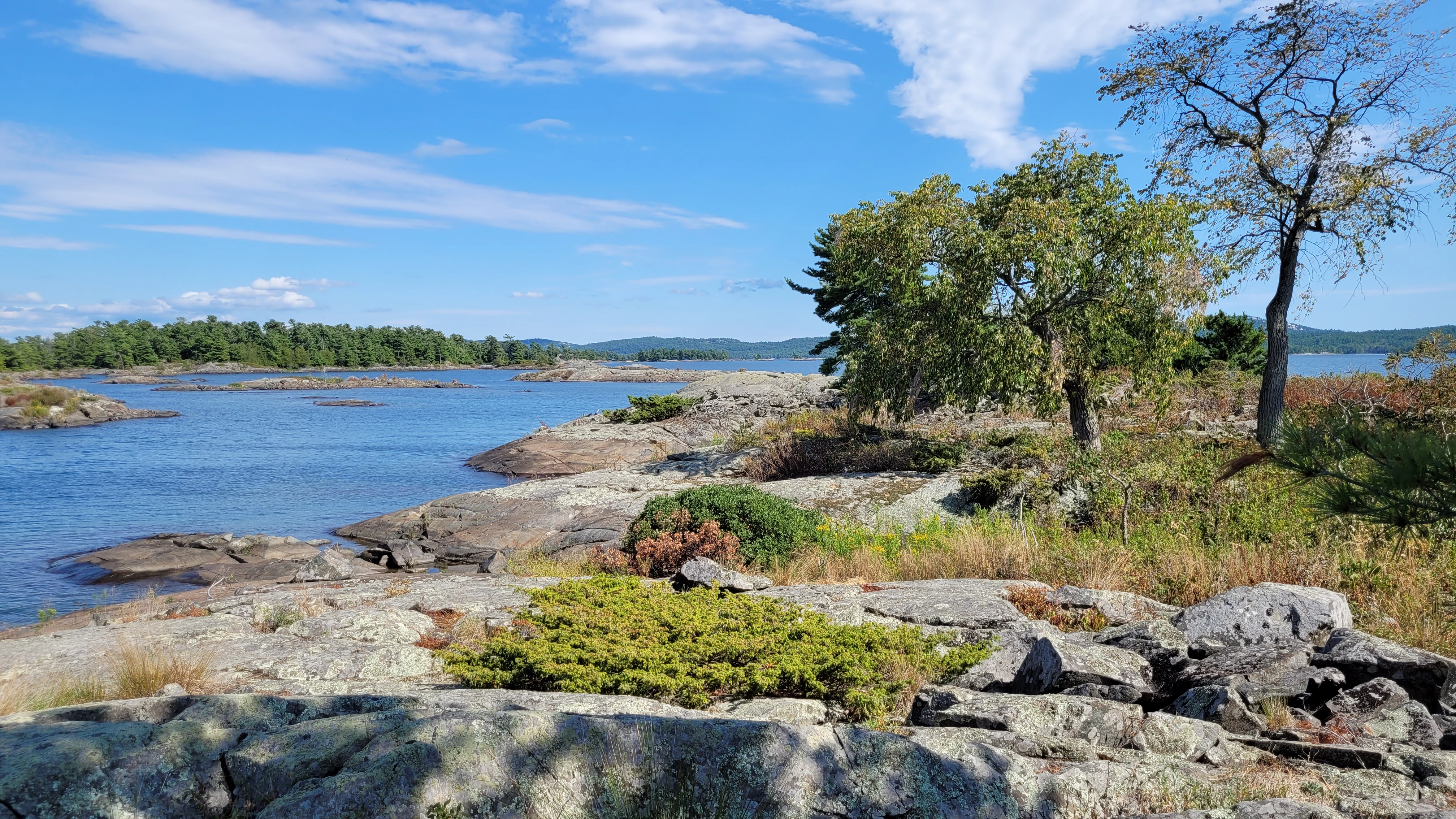 Smooth granite rocks from glacial erosion on Martins Island in the thirty thousand islands archipelago of the georgian bay